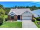 Charming one-story brick home with manicured lawn and a two car garage in a suburban neighborhood at 1307 Wayne Ave, New Smyrna Beach, FL 32168