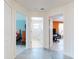 Bright hallway offers access to a stylish bathroom and bedrooms with ample natural light at 1307 Wayne Ave, New Smyrna Beach, FL 32168