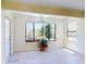 Inviting living room featuring a large window providing scenic views and ample natural light at 1307 Wayne Ave, New Smyrna Beach, FL 32168