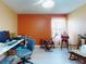 Comfortable office features a ceiling fan and a desk with computer at 1307 Wayne Ave, New Smyrna Beach, FL 32168