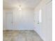 Bright room with tile floors and an ornate light fixture at 1307 Wayne Ave, New Smyrna Beach, FL 32168