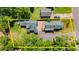 Aerial view of the property showcasing the houses, landscaping, and the layout of the yard at 135 12Th St, Daytona Beach, FL 32117