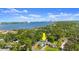 Aerial view of a house with a large body of water and city skyline in the background at 135 12Th St, Daytona Beach, FL 32117