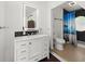 Modern bathroom with sleek vanity, illuminated mirror, and walk-in shower at 135 12Th St, Daytona Beach, FL 32117