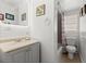 Cozy bathroom featuring a single sink vanity and walk-in shower at 135 12Th St, Daytona Beach, FL 32117