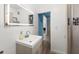 Bright bathroom with a modern sink, vanity and a walk in shower at 135 12Th St, Daytona Beach, FL 32117