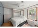 Cozy bedroom with a queen-sized bed, bright window, and neutral decor, offering a comfortable living space at 135 12Th St, Daytona Beach, FL 32117