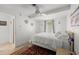 Bright bedroom featuring a cozy bed, area rug, and neutral decor at 135 12Th St, Daytona Beach, FL 32117