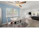Cozy dining area adjacent to living room, featuring a table with chairs and window at 135 12Th St, Daytona Beach, FL 32117