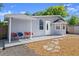 Inviting covered patio with chairs, perfect for outdoor relaxation at 135 12Th St, Daytona Beach, FL 32117