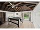 Bright game room with ping pong table, wood ceiling, and sliding doors at 135 12Th St, Daytona Beach, FL 32117