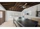 Game room showcasing an exposed beam ceiling and a combination ping pong/pool table at 135 12Th St, Daytona Beach, FL 32117