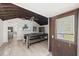 Open game room with ping pong table, wood ceiling, and view into kitchen at 135 12Th St, Daytona Beach, FL 32117