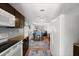 Open kitchen with a view into the dining and living area, featuring essential appliances and plenty of natural light at 135 12Th St, Daytona Beach, FL 32117