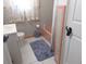 Bathroom featuring a tiled tub and shower combo at 1627 Umbrella Tree Dr, Edgewater, FL 32132
