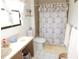 Bathroom featuring a decorative shower curtain at 1627 Umbrella Tree Dr, Edgewater, FL 32132