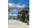 Whistle Stop Park entrance with palm trees and a blue building at 1627 Umbrella Tree Dr, Edgewater, FL 32132