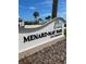 Menard-May Park sign with palm trees under a beautiful blue sky at 1627 Umbrella Tree Dr, Edgewater, FL 32132