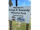 George R. Kennedy Memorial Park sign with palm trees under a beautiful blue sky at 1627 Umbrella Tree Dr, Edgewater, FL 32132