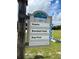 Community sign at Whistle Stop Park featuring tennis, baseball, and dog park for residents to enjoy at 1627 Umbrella Tree Dr, Edgewater, FL 32132