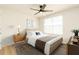 Cozy bedroom with a ceiling fan, a window, and warm neutral decor at 1674 Coulter Ln, Port Orange, FL 32129