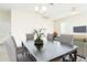 The dining room offers an inviting atmosphere for gatherings, complemented by natural light and modern decor at 1674 Coulter Ln, Port Orange, FL 32129