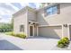 Two-story home featuring a two car garage and a cozy front entrance at 1674 Coulter Ln, Port Orange, FL 32129
