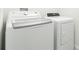 Modern laundry room with white front load washer and dryer at 1674 Coulter Ln, Port Orange, FL 32129