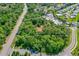 Aerial view of a heavily treed home lot with an estimate of the lot lines for this secluded property at 1786 Taylor Rd, Port Orange, FL 32128