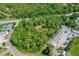 Aerial view of a heavily treed home lot with an estimate of the lot lines for this secluded property at 1786 Taylor Rd, Port Orange, FL 32128