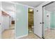 Bathroom featuring a tiled shower, tile floors and a closet with additional storage space at 1786 Taylor Rd, Port Orange, FL 32128