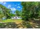 Inviting home with a spacious front deck and lush green lawn at 1786 Taylor Rd, Port Orange, FL 32128