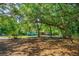 A charming house with a large front yard surrounded by lush greenery at 1786 Taylor Rd, Port Orange, FL 32128
