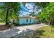 Well-maintained home featuring a two-car garage and long driveway, ideal for parking and storage at 1786 Taylor Rd, Port Orange, FL 32128