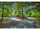 A charming one-story home surrounded by mature trees offering natural shade and curb appeal at 1786 Taylor Rd, Port Orange, FL 32128
