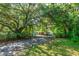 A charming one-story home surrounded by mature trees offering natural shade and privacy at 1786 Taylor Rd, Port Orange, FL 32128