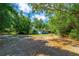 Spacious yard with mature trees offering privacy and natural beauty at 1786 Taylor Rd, Port Orange, FL 32128