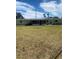 Spacious backyard with a screened-in patio, perfect for outdoor entertaining at 1830 Needle Palm Dr, Edgewater, FL 32132