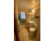 Bathroom with tile floor, vanity, shower-tub combination and vintage wallpaper border at 1830 Needle Palm Dr, Edgewater, FL 32132
