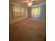Neutral bedroom featuring curtains, a ceiling fan, and carpet flooring at 1830 Needle Palm Dr, Edgewater, FL 32132