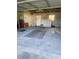 Spacious garage with block walls, and a metal ceiling at 1830 Needle Palm Dr, Edgewater, FL 32132