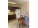 Charming kitchen with a dining area, refrigerator, and plenty of cabinet space at 1830 Needle Palm Dr, Edgewater, FL 32132