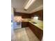 Functional kitchen with wood cabinets, durable countertops, and clean appliances at 1830 Needle Palm Dr, Edgewater, FL 32132