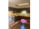 Well-maintained kitchen featuring wood cabinets, a classic stove, and a bright countertop at 1830 Needle Palm Dr, Edgewater, FL 32132