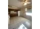 Bright kitchen featuring wood cabinets, a refrigerator, and tile flooring for easy maintenance and functionality at 1830 Needle Palm Dr, Edgewater, FL 32132