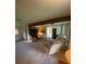 Spacious living room with carpet, exposed beam, and comfortable seating at 1830 Needle Palm Dr, Edgewater, FL 32132