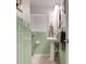 Bathroom featuring a pedestal sink with a jade green tiled wall at 184 Azalea Rd, Edgewater, FL 32141