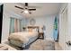 Comfortable bedroom with a surfboard wall accent and hardwood flooring at 184 Azalea Rd, Edgewater, FL 32141