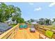 View of the outdoor deck with waterfront views and plenty of space for relaxing and entertaining at 184 Azalea Rd, Edgewater, FL 32141