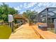 Waterfront dock with a lift and lounge space, perfect for boats and accessing the pool at 184 Azalea Rd, Edgewater, FL 32141